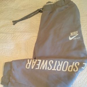 Men’s gray Nike sweatpants logo down side